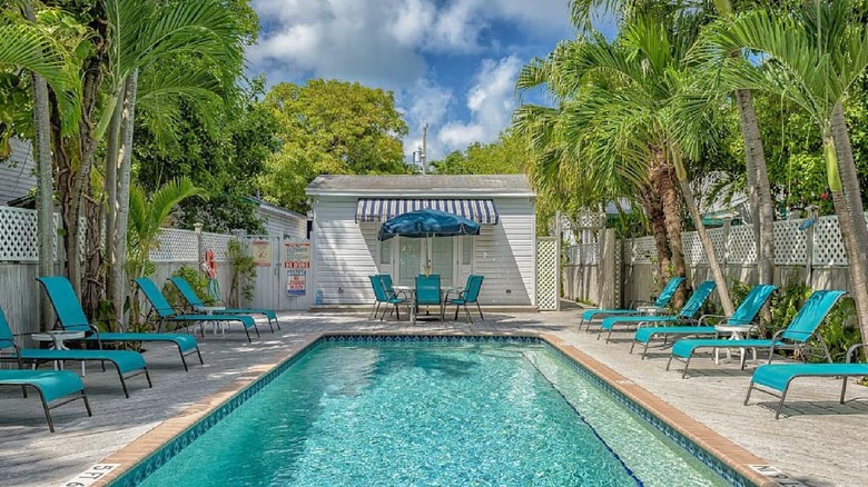 swimming pool with lounge chairs