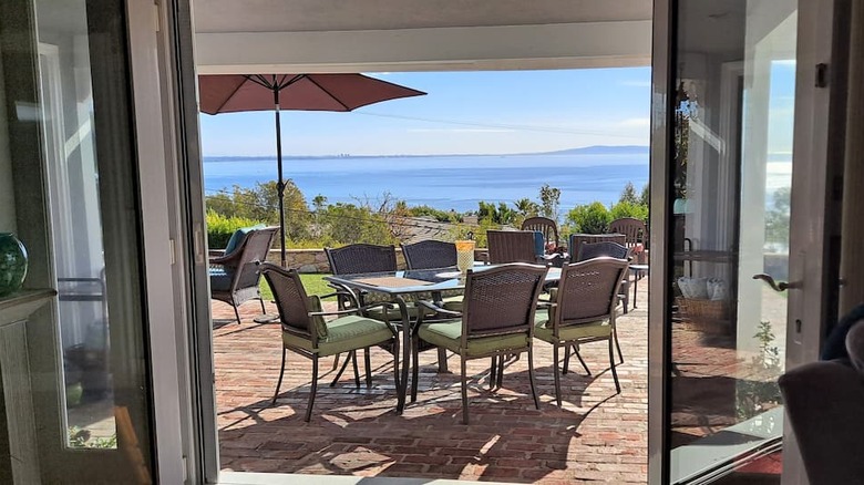 patio with furniture overlooking ocean