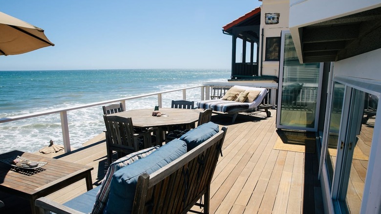 patio with furniture overlooking ocean