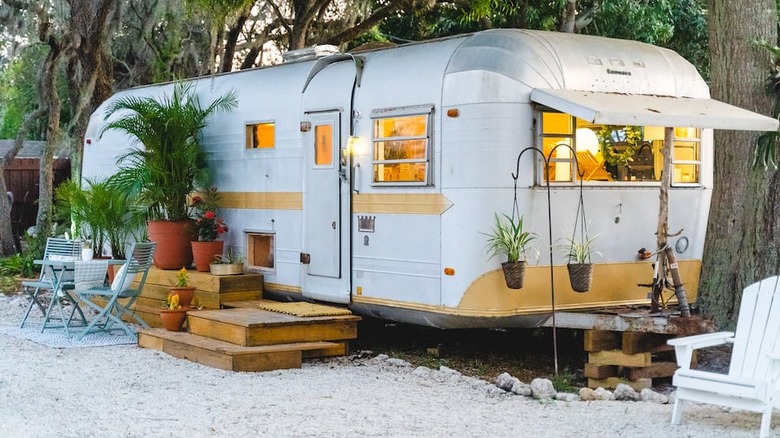 white Airstream with yellow accents 