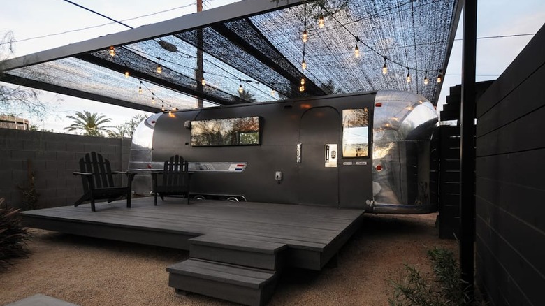 Gray and black Airstream with lights 