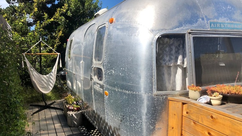 Silver Airstream with white hammock