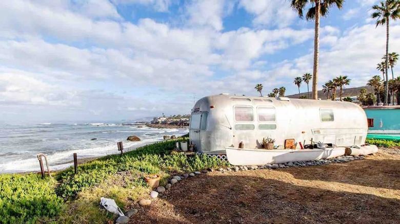 silver Airstream by the ocean