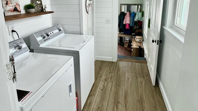 Speed Queen laundry machines in a white laundry room