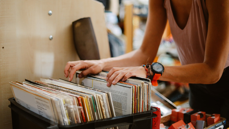 person sifting through vinyl records