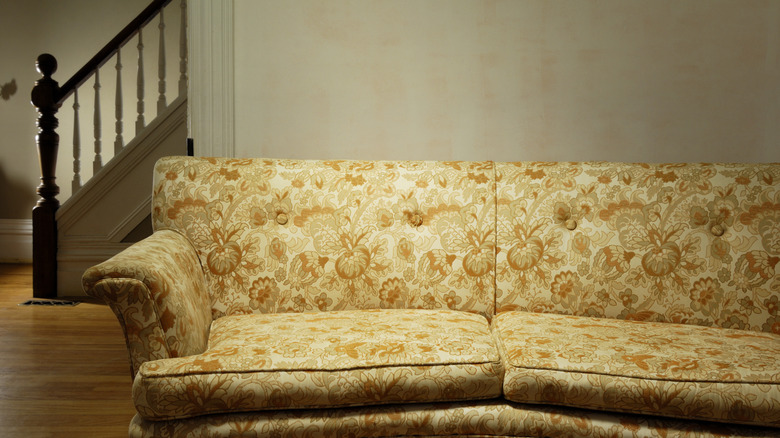 Vintage sofa with yellow floral upholstery