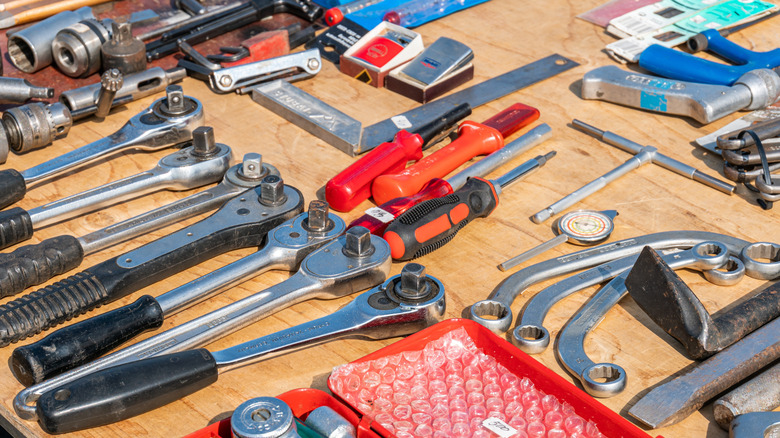 used hand tools on outdoor wood table