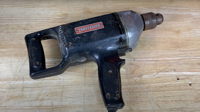 Vintage Sears Craftsman drill on wood table