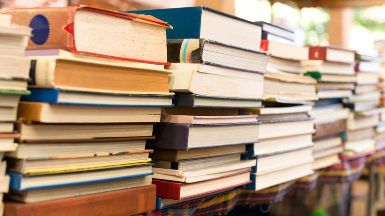 pile of books on table