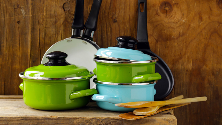 green and blue cookware on counter