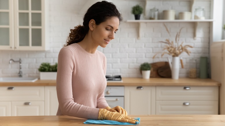 Woman cleaning kitchen 