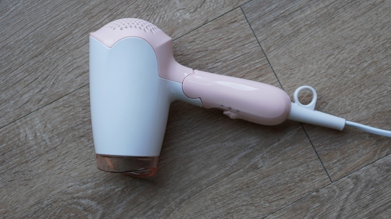 hair dryer on wooden floor