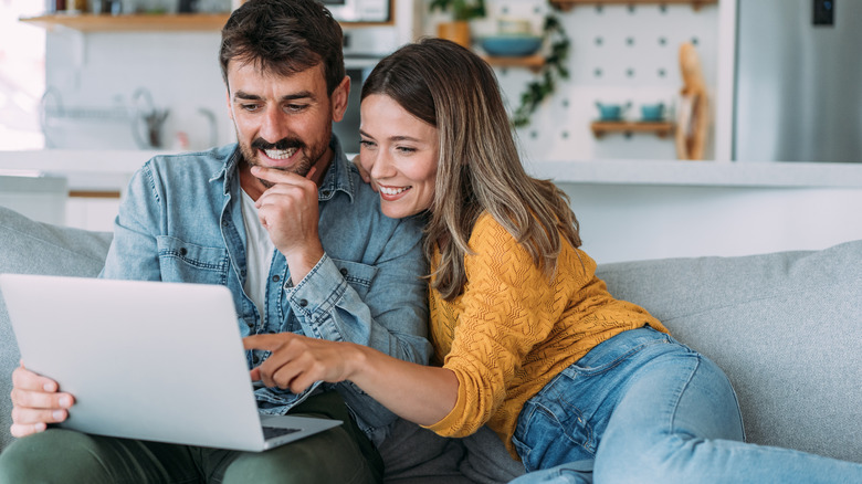 Couple looking at laptop together