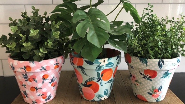 Decorative planters wrapped in patterned fabric