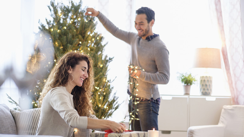 Couple decorating their home for Christmas