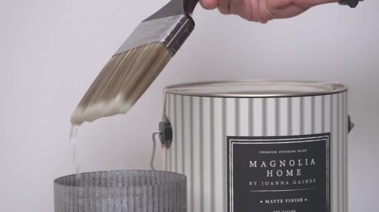 Joanna Gaines dipping brush in water