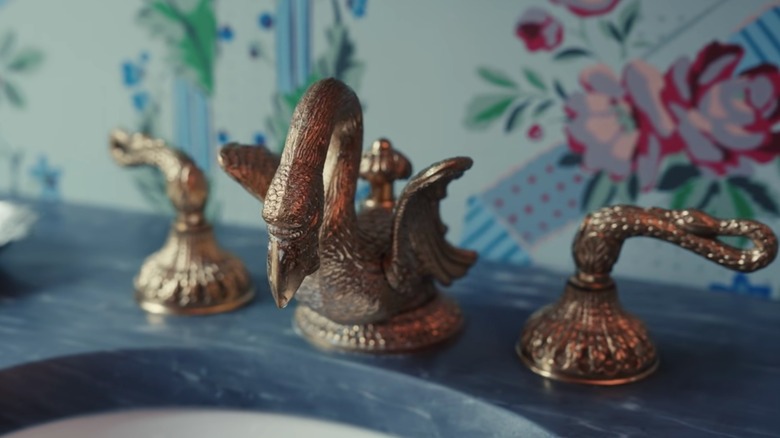 Golden swan taps in bathroom