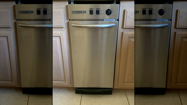 A stainless stell KitchenAid kitchen trash compactor