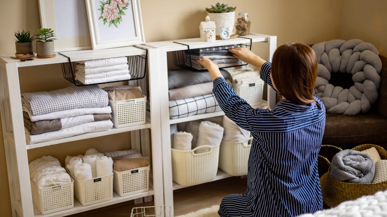 Person organizing their bedroom