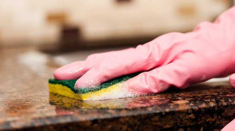 Washing granite countertops with sponge