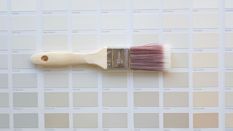 neutral paint swatches under paintbrush