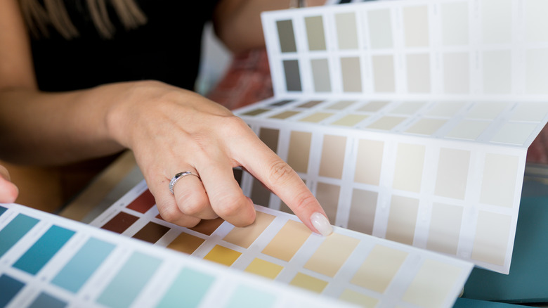 woman choosing paint color