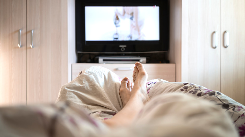 plain bedroom with TV 