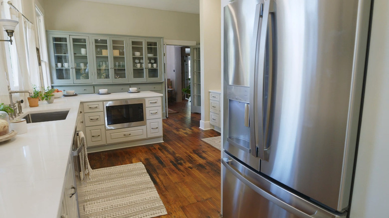 Restored wood floors warm kitchen