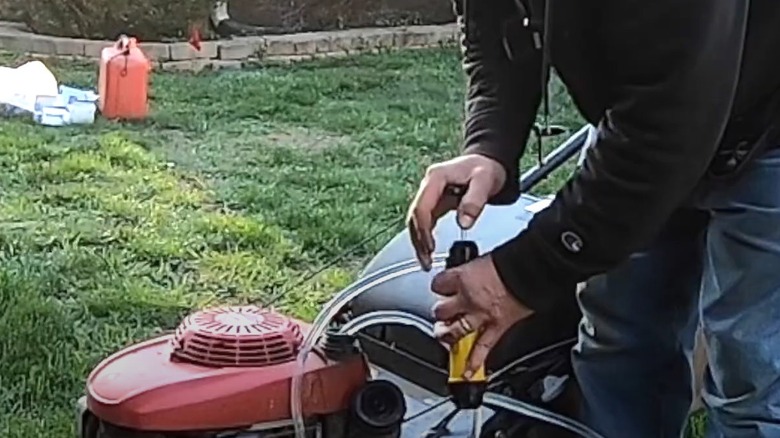 siphoning gas from a mower