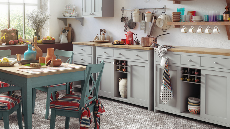 Farmhouse kitchen with light gray cabinets and natural wood countertops