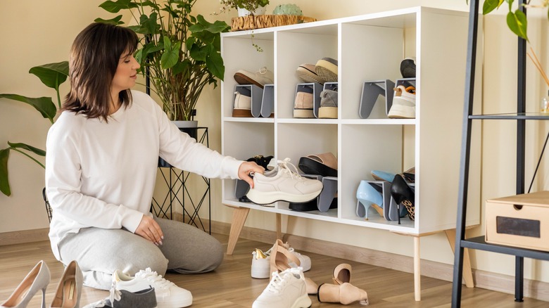 Woman sorting through shoes