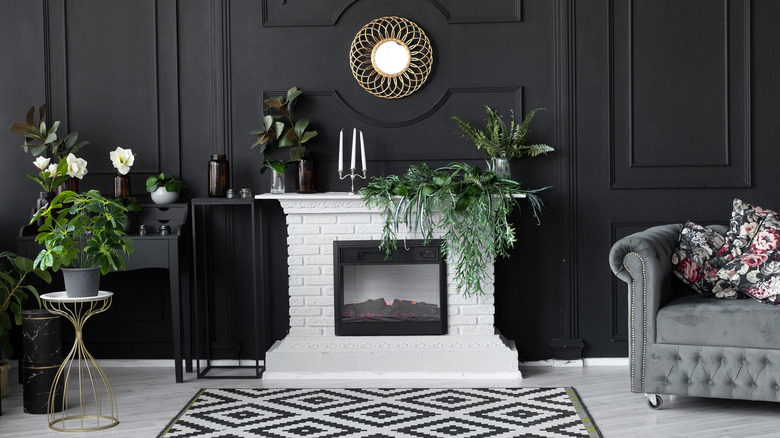 White fireplace contrasting darkened wall