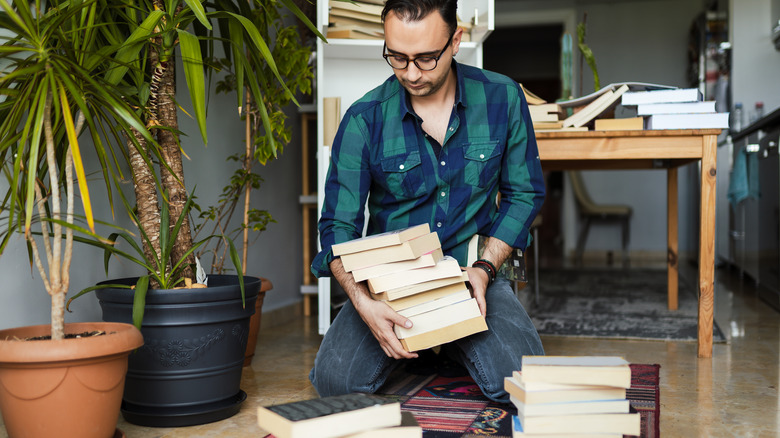 Man organizing his books