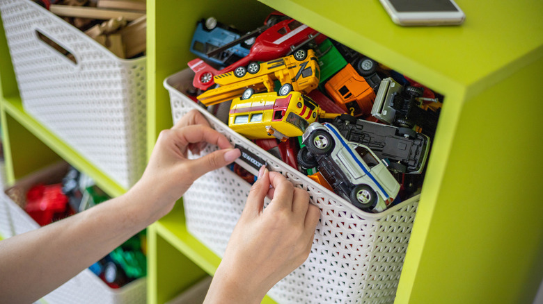 Woman sorted toys into baskets