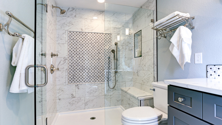 A small bathroom with a large walk-in shower