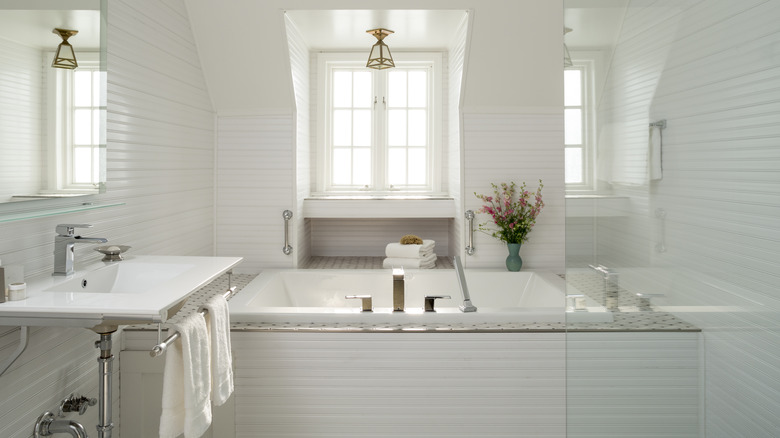 White bathroom with a large built in tub