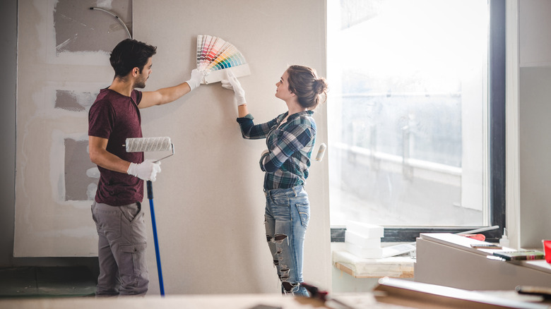 Couple choosing color for bedroom