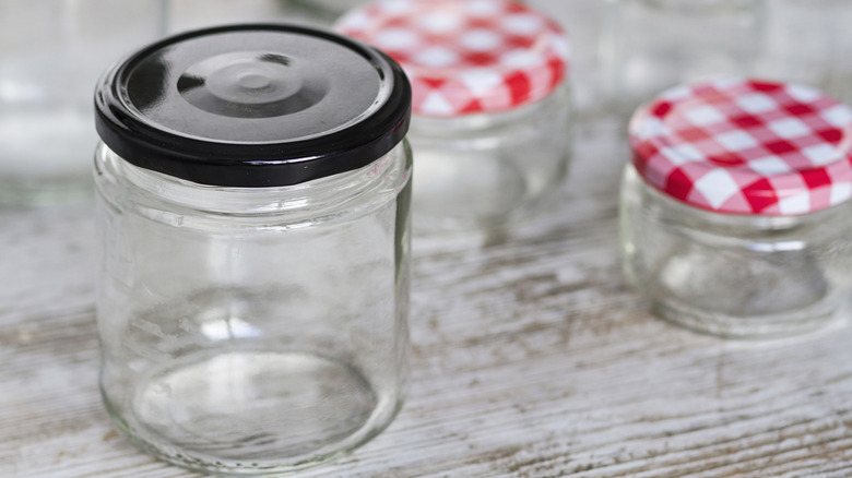 glass jars with lids in different sizes on a countertop