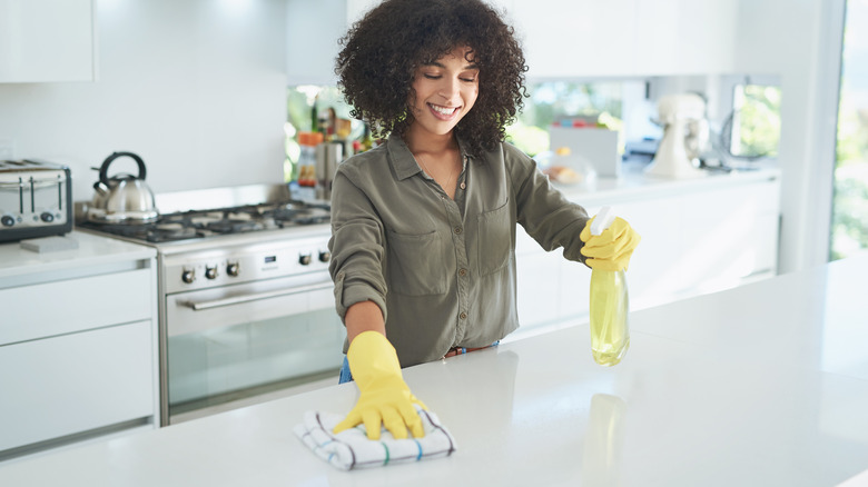 Woman cleaning countertops