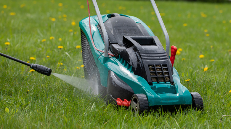 hose spraying lawnmower