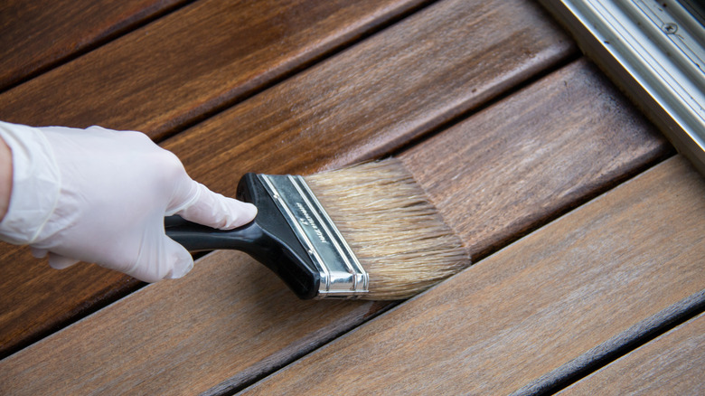 paintbrush with wood deck sealer