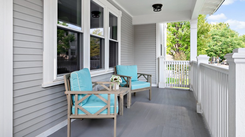 grey house with gray deck and white trim