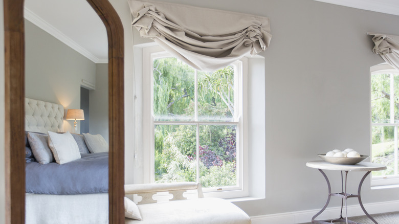 Bedroom with mirror in corner