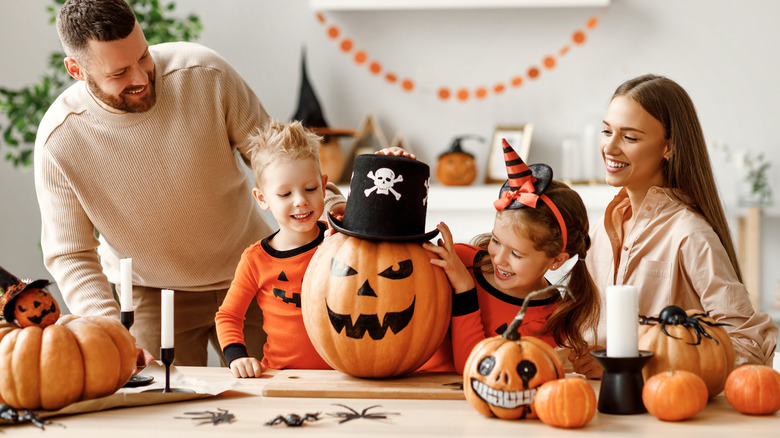 Family with painted pumpkins