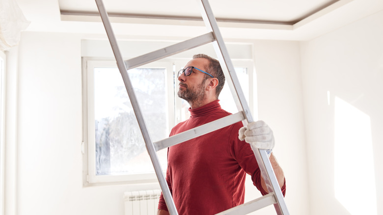man holding ladder