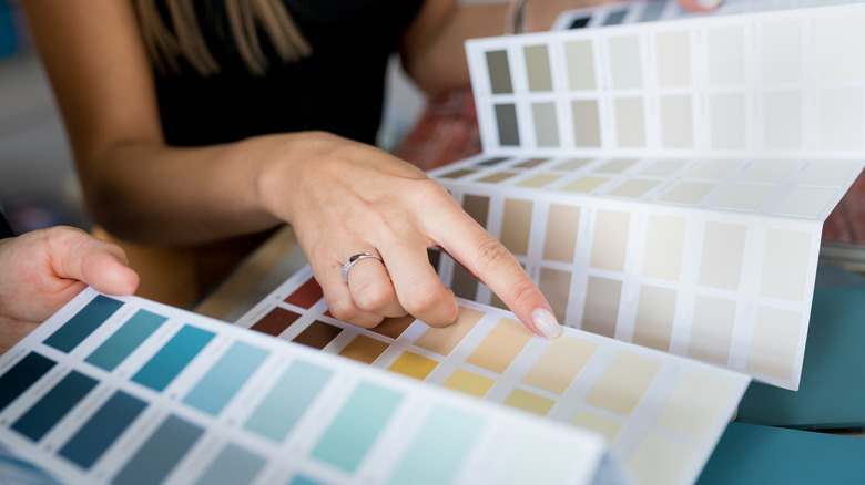 Woman selecting paint samples