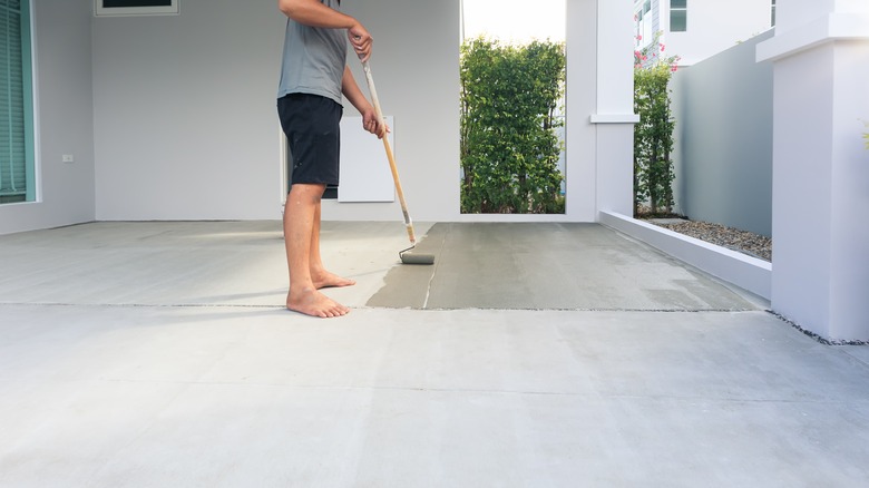 Person applying a floor leveling solution