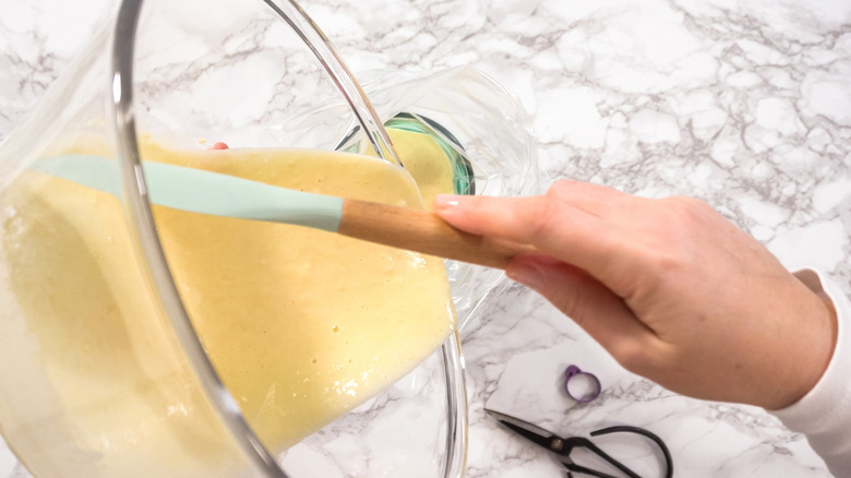 Woman pouring pancake batter into Ziploc bag