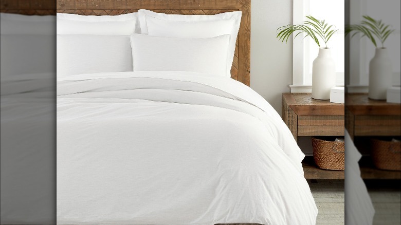 white duvet cover on made bed