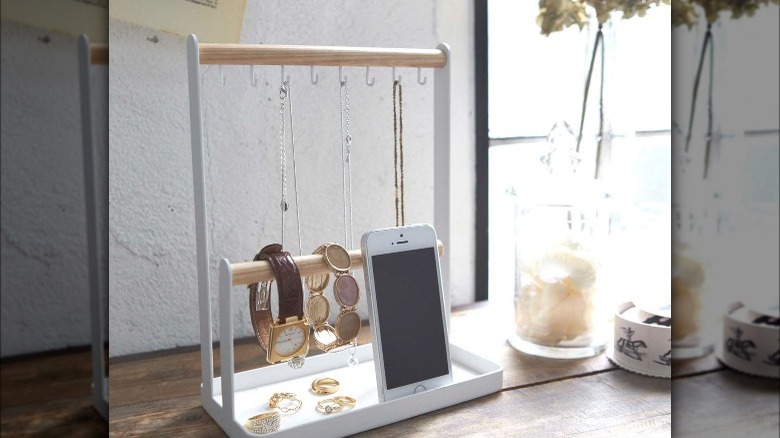 white and wood accessory stand